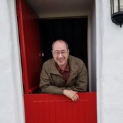 Pierre Hecker looks out of an Irish cottage doorway