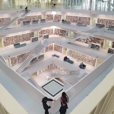 An overhead view of several descending stories of a modernist library