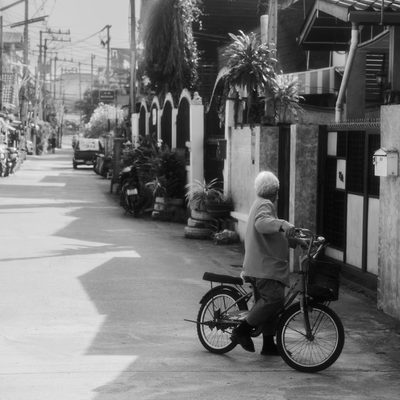 A woman riding a bicycle in a street