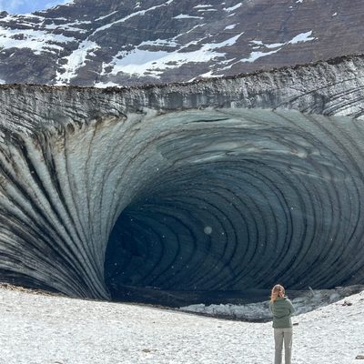 A spiralling cave mouth in snow