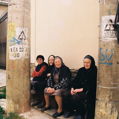 Four old women on a bench