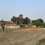 Playing a round of cricket with the novice monks at the Korean temple in Bodh Gaya.