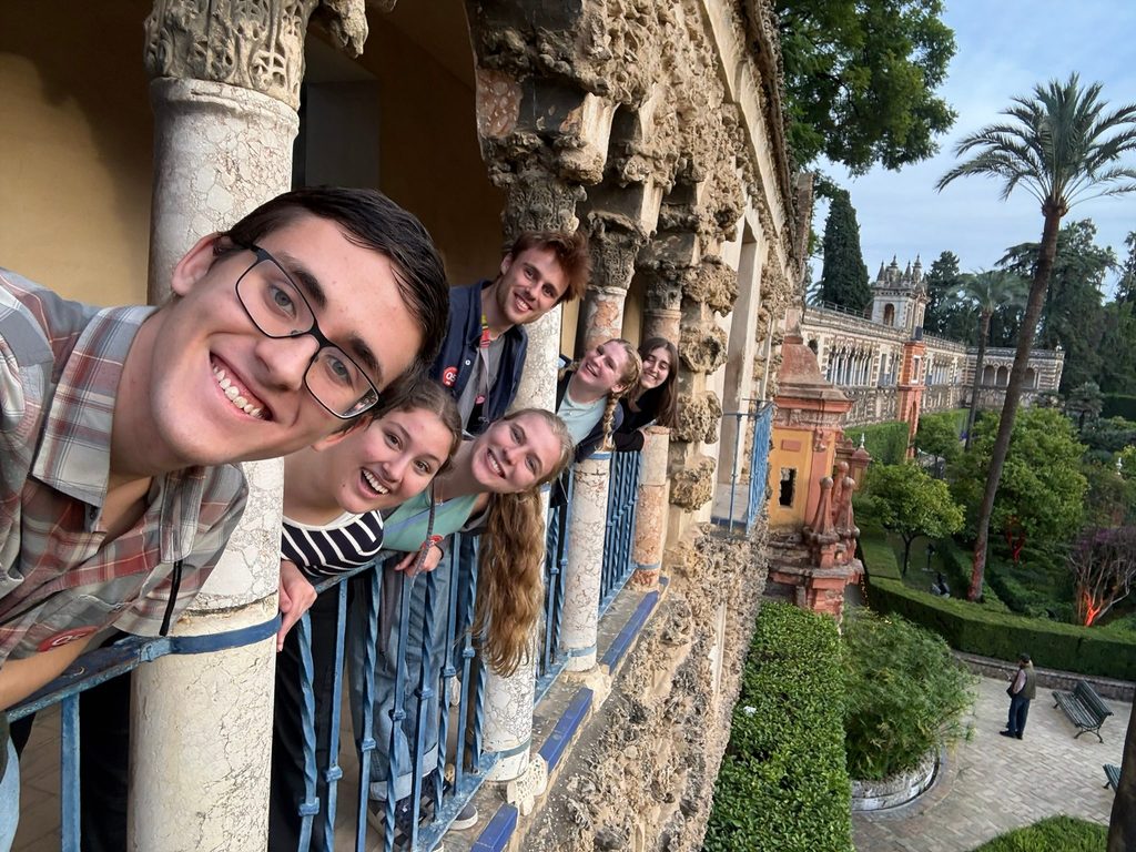 Six Carls brighten the weathered arcade of the Real Alcázar in Seville.