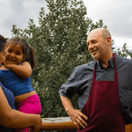 Owner of the sole restaurant in the valley with his wife and daughter