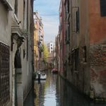 This photo showcases one of the many side canals of Venice, with the soft colors and tranquil lighting breathing a sense of everyday life within the city into the picture.