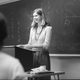 Bev in front of a blackboard