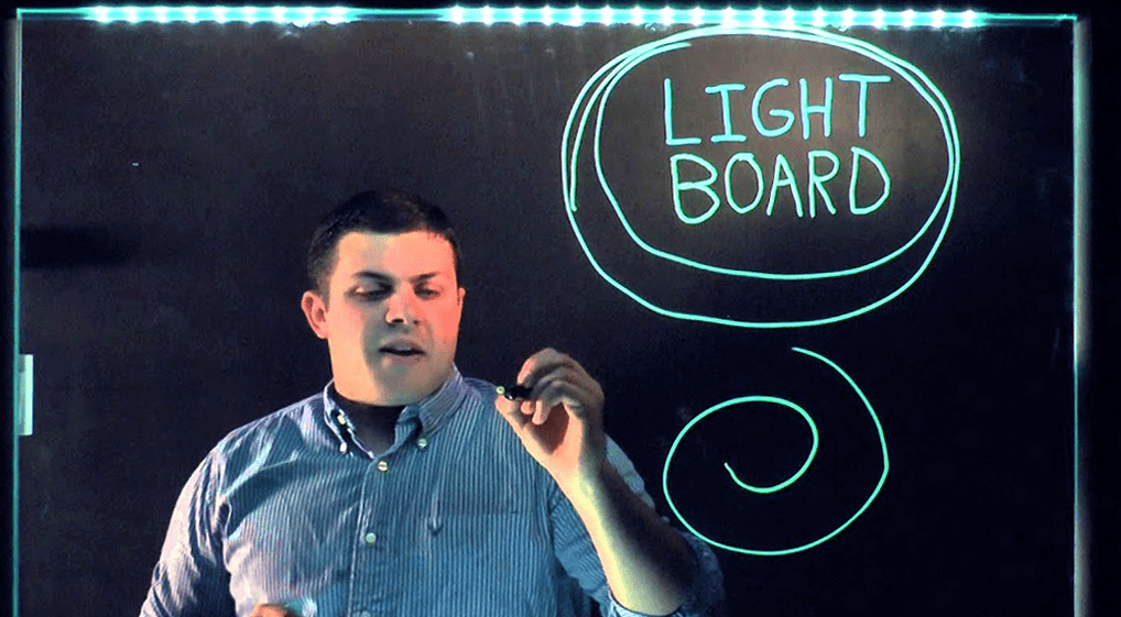 Eric Mistry draws on a light board