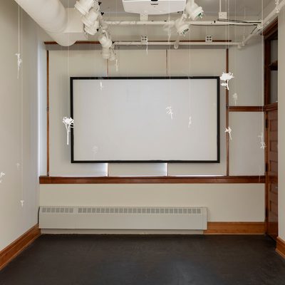 Art installation: screen and hanging objects