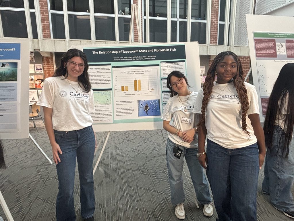 3 students at poster session