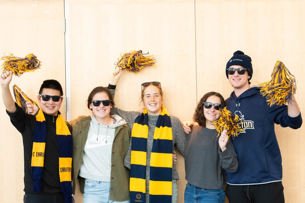 Students celebrate their bright future while wearing Carleton colors