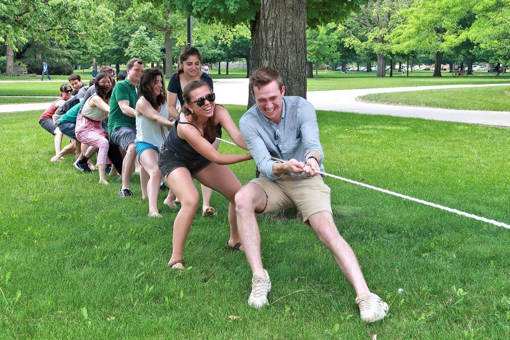 students pull on a rope in a "tug-of-war" contest