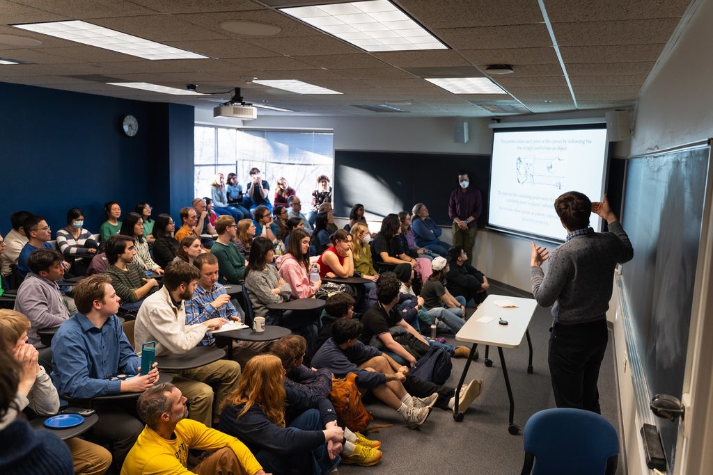 classroom of students viewing a comps presentation