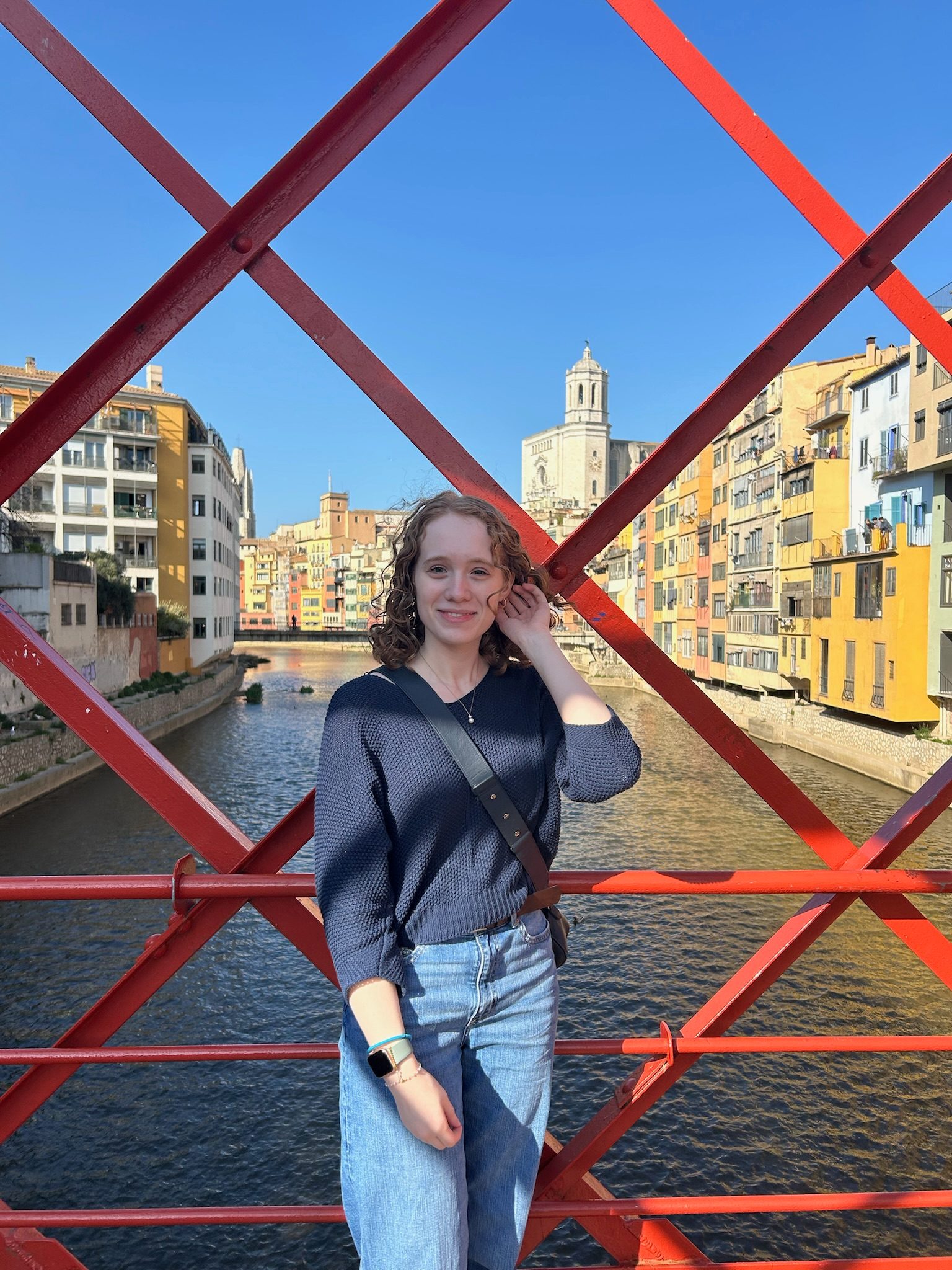 Katie Myerholtz on a bridge over a  canal.