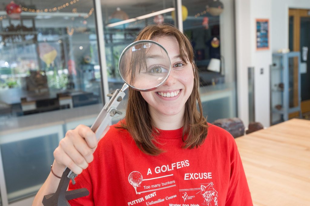 Student with magnifying glass