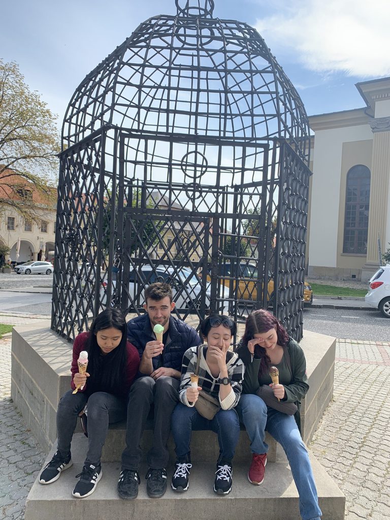 Sara, Joey, Hisui, and I pose in front of the Cage of Shame