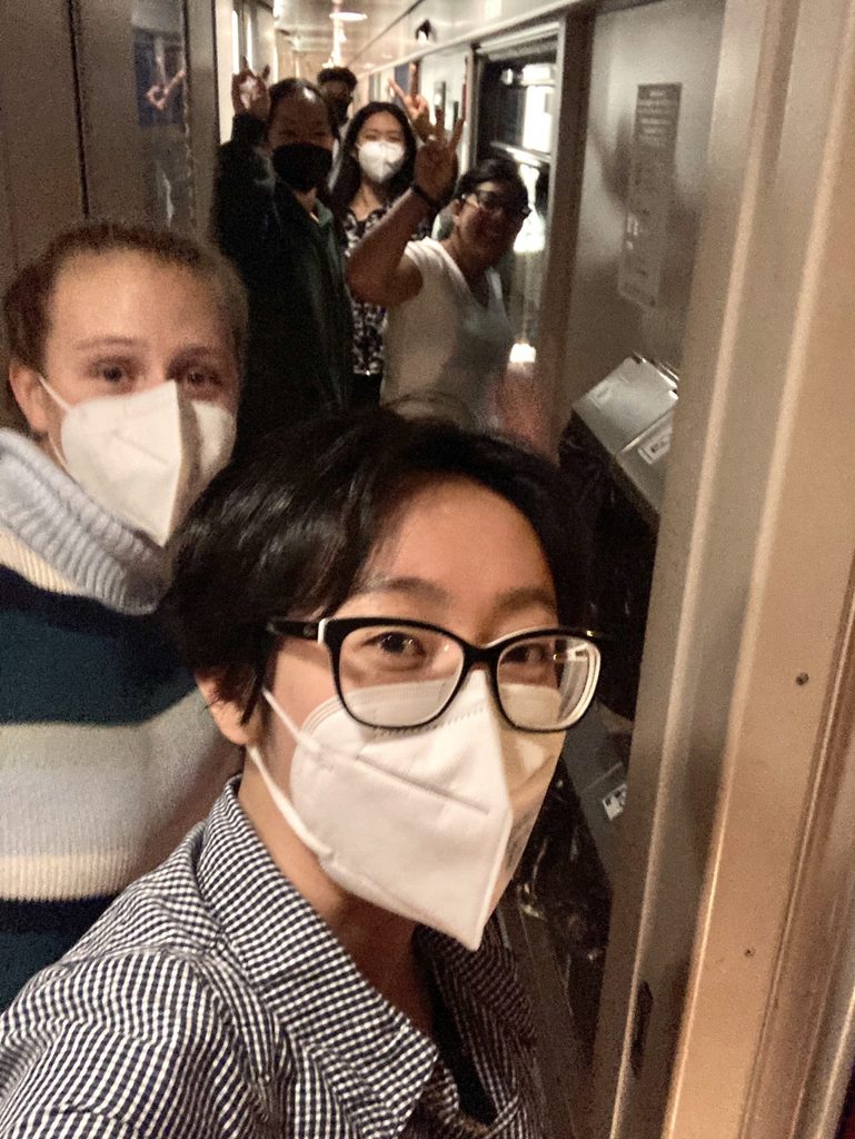 The group gathered in the hallway of our sleeper train! 