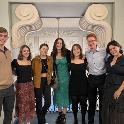 From left to right: Sam, Elana, Xóchi, Meg, Thea, Brady, and Sadie dressed for the Opera