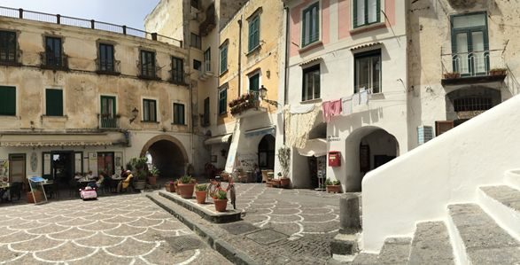 The piazza outside our apartment. The arch at the center of this photo leads to the beach!