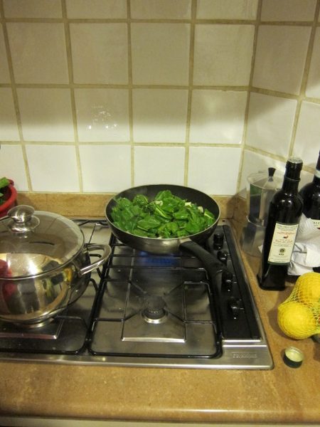 Sauteeing Biettina with olio d'oliva (olive oil) and aglio (garlic)
