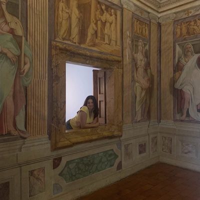 Me in a decorative window into a frescoed room at Villa d’Este. Note the many toga’d people