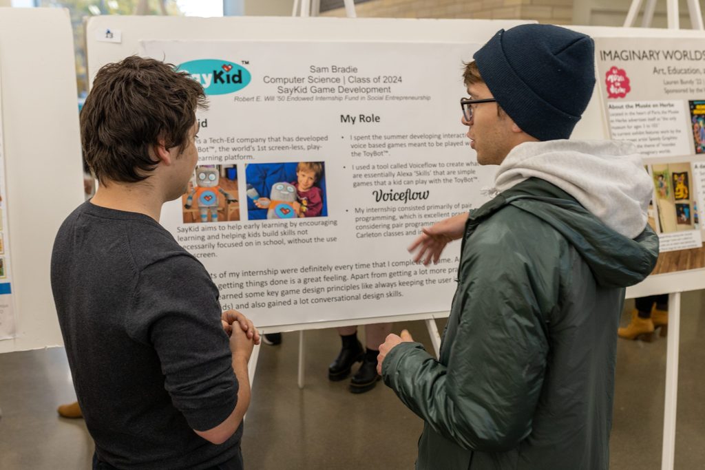 students looking at internship poster