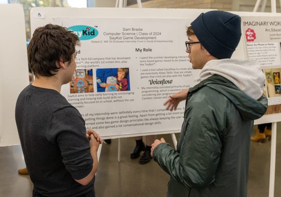 students looking at internship poster