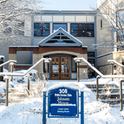 Front of Johnson House building, covered in snow