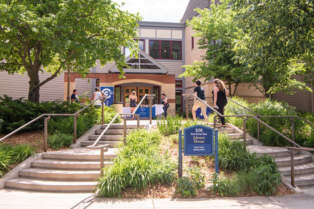 Students outside of Johnson House gathered around for a Career Center event