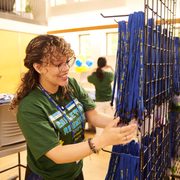 Student worker organizing lanyards for Reunion 2024 weekend