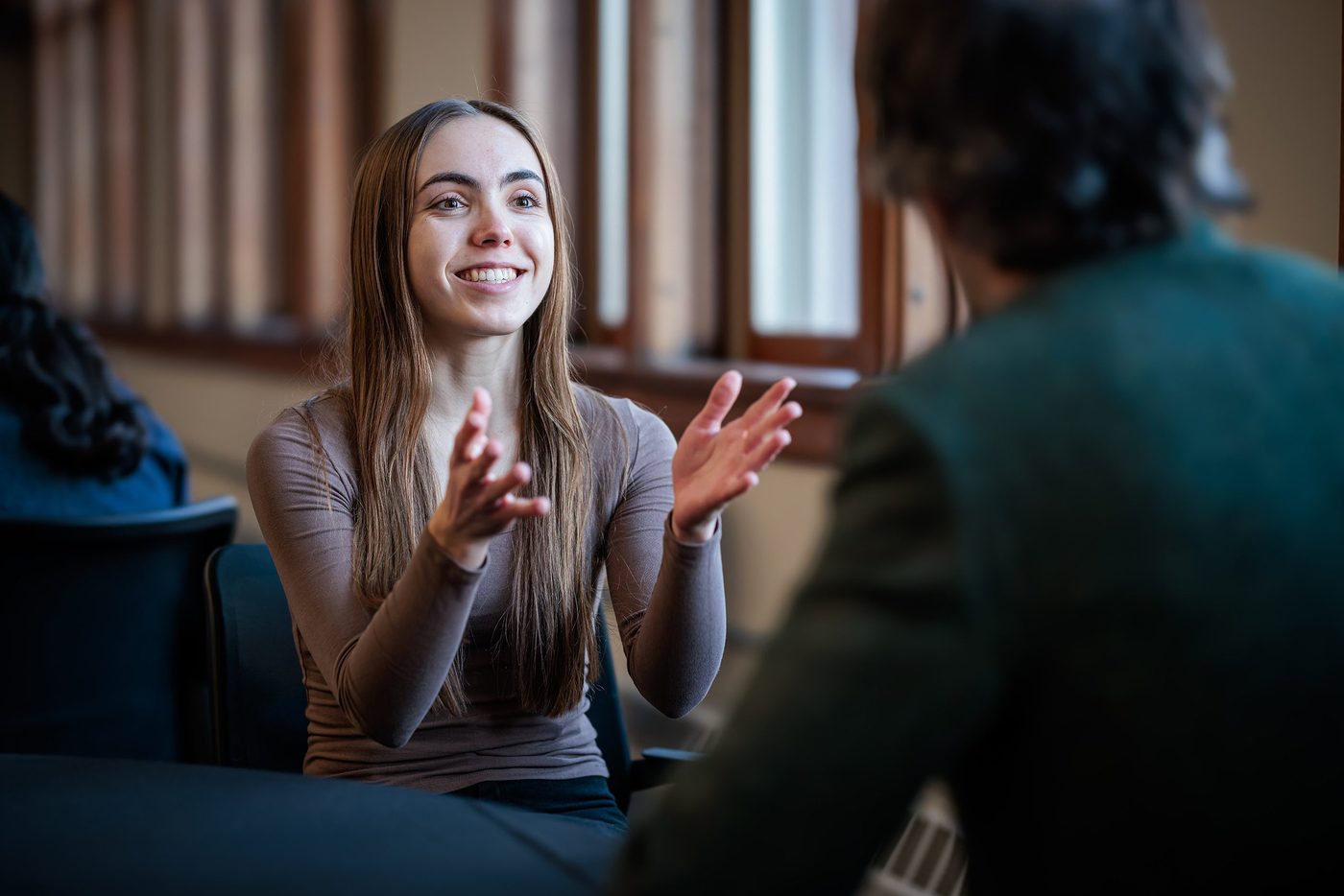 Two students having an animated conversation