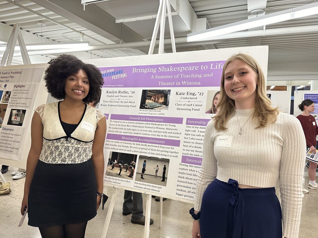Two students present a poster about their summer internship: Bringing Shakespeare to Life, a summer of teaching and theater in Winona, Minn.