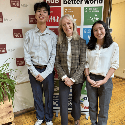Naomi Fina '26 and Daniel Yan' 26 with their site host, Susan Hammel ’86, during their Applied Externship at Cogent Consulting