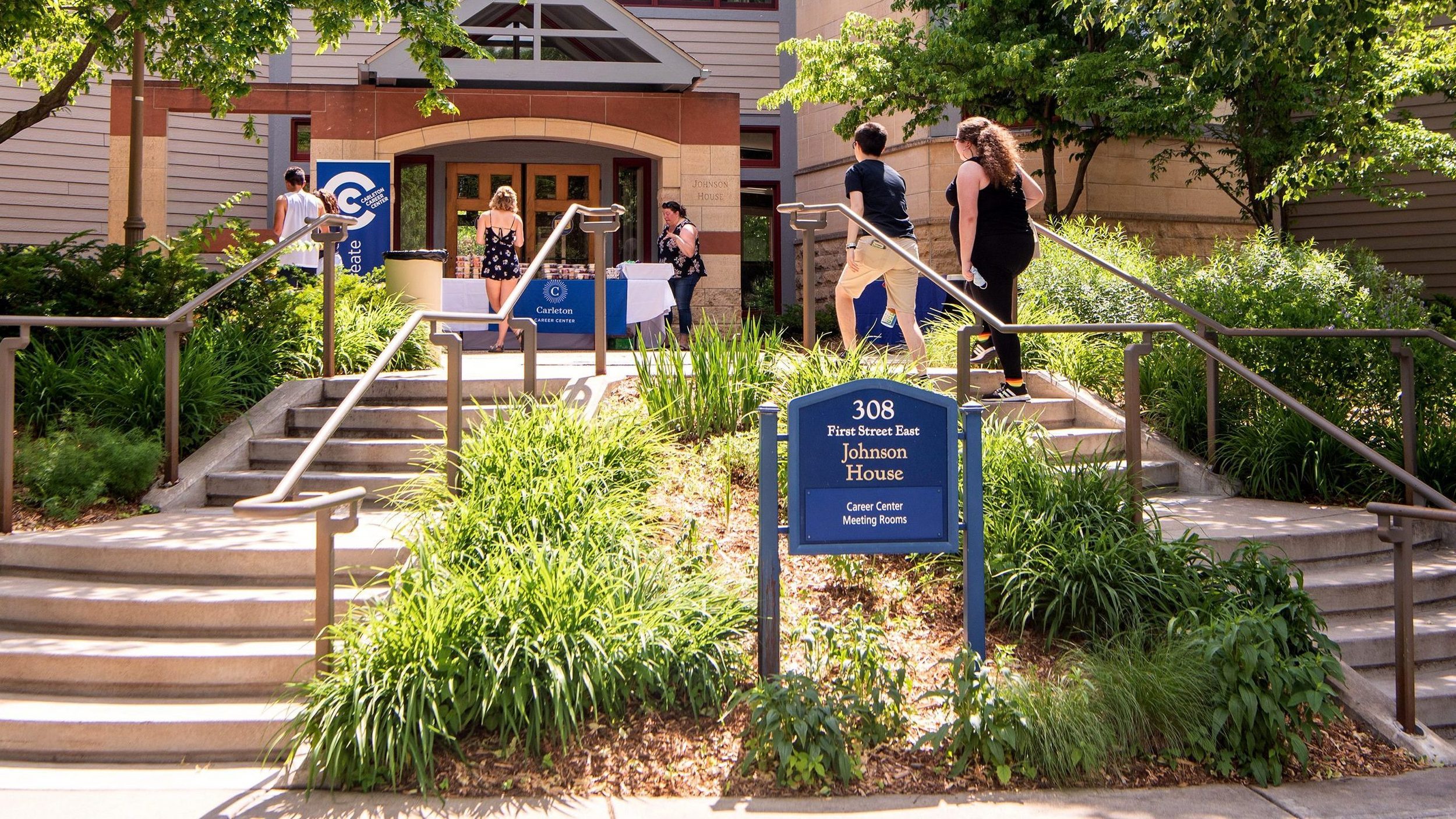Students walk up the steps to Johnson House, home of the Career Center