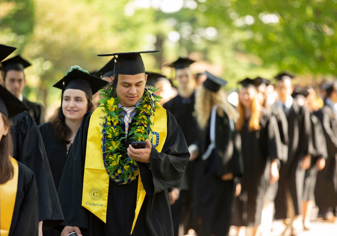 A long line of students at commencement