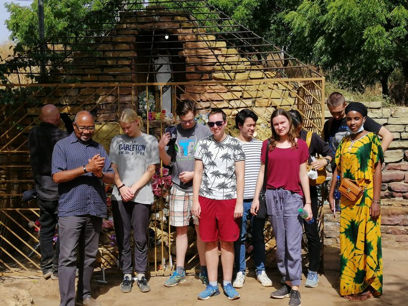 group picture of students in front of old building