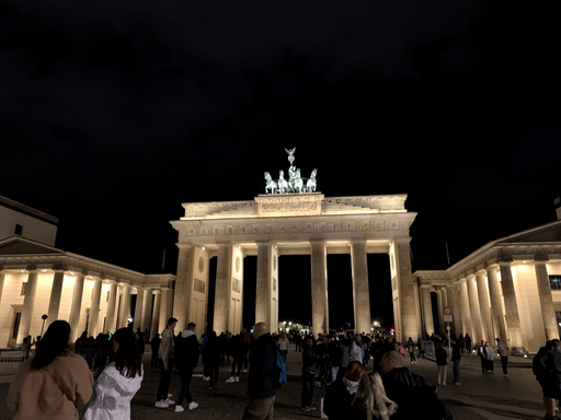 The Brandenburg Gate, lit up at night.