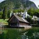 picture of wooden house on lake in austria