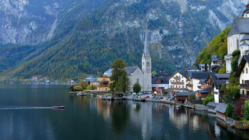 Hallstatt - Castle on water with mountains in the back in austria