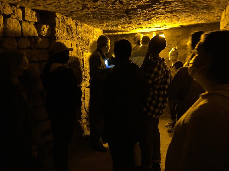 students on a tour in teh catacombs