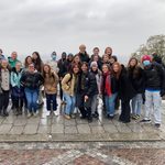 group of students psoing on a rainy day