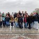 group of students psoing on a rainy day