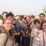 group of students infront of a city