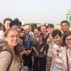 group of students infront of a city