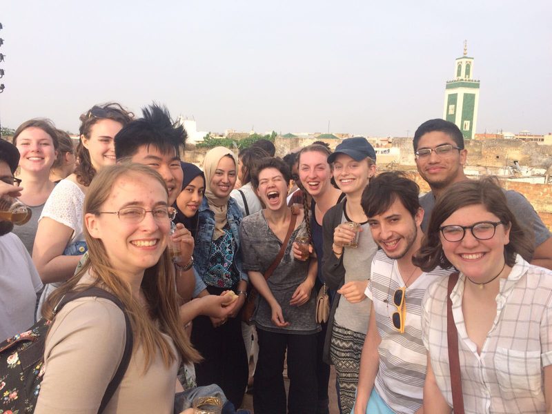 group of students infront of a city