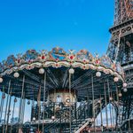carousell with eiffel tower in background