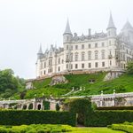 a castle on a hill on a cloudy morning