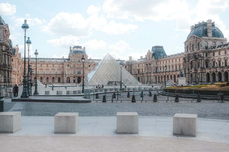 the louvre with the glass pyramid in the foreground