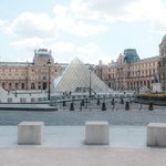 the louvre with the glass pyramid in the foreground