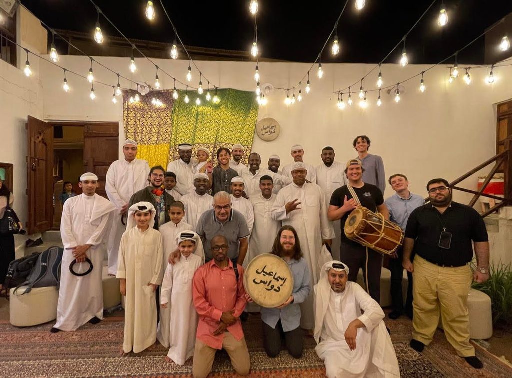 thabiti posing witha group of people on the africa and arabia proram