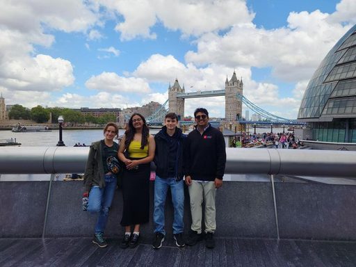 friends pose by Tower Bridge